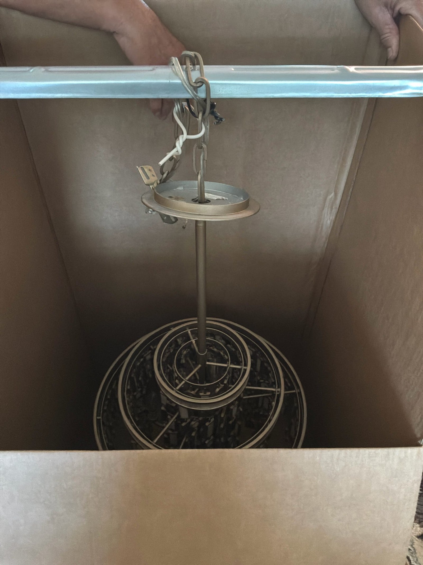 Pre-removal view of Venice chandelier and high-ceiling wiring